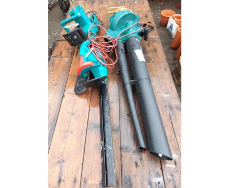 A Bosch electric chainsaw and Bosch hedge trimmer - sold with a garden blower