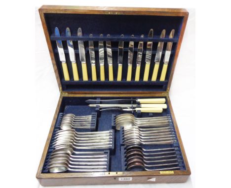 A vintage oak canteen containing a six place setting of Mappin &amp; Webb silver plated cutlery with ivorine handles
