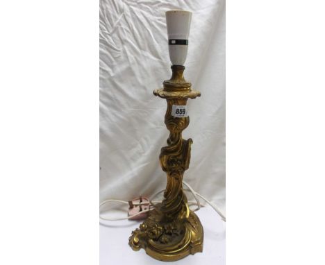 An early 20th Century French gilt bronze table lamp of candlestick form with Rococo scroll decoration - marked Gagneau Paris 