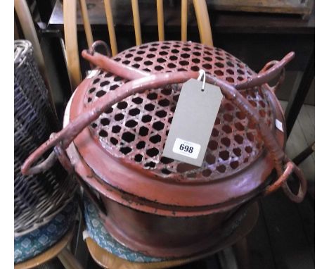 A vintage Northern Thailand red lacquered livestock carrier with reticulated lid and carry handles