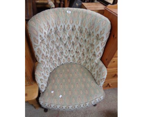 An antique style high tub back armchair with button back machine tapestry upholstery, set on cabriole front legs