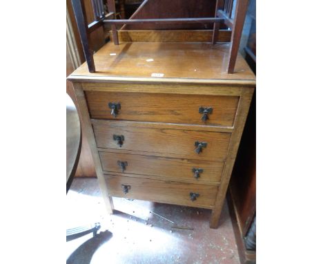A 62cm vintage oak chest with flight of four drawers, set on block feet