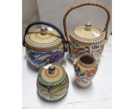 An Art Deco Poole Pottery biscuit barrel with blue bird decoration (a/f), a similar Carter, Stabler &amp; Adams preserve pot 