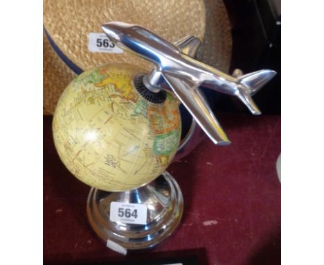 A modern globe with aeroplane finial