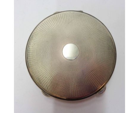 A silver circular compact case with engine turned decoration and blank cartouche - London 1951