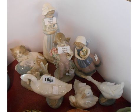 Two Lladro figurines, one depicting a young girl with bird perched on her finger, the other a girl holding a basket of flower