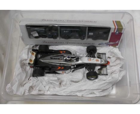 Two crates containing a quantity of toy cars including Lledo boxed R.A.F. Ground Crew Support set, racing car, etc.
