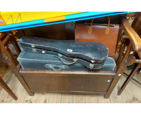 A 1.15m early 20th Century oak locker hall seat with panelled back and flanking stick stands, set on block feet