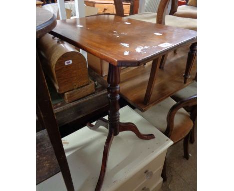 A 19th Century mahogany pedestal table with canted oblong tilt-top, set on turned pillar and tripod base