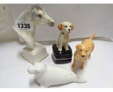 Four ceramic animal figurines comprising Royal Worcester bone china horse bust, Beswick labrador, Foster Cornwall seal figuri