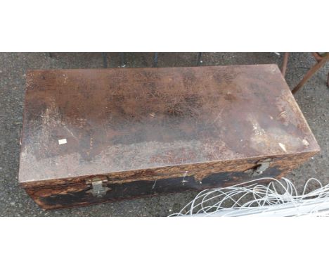 A large black metal transit trunk