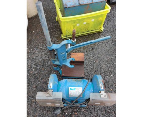 A pillar drill stand and an electric bench grinder