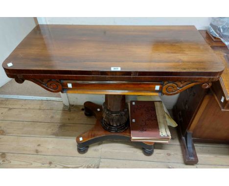 A 92cm 19th Century rosewood fold-over card table with green baise inset top and scrolls to apron. set on turned tulip pillar