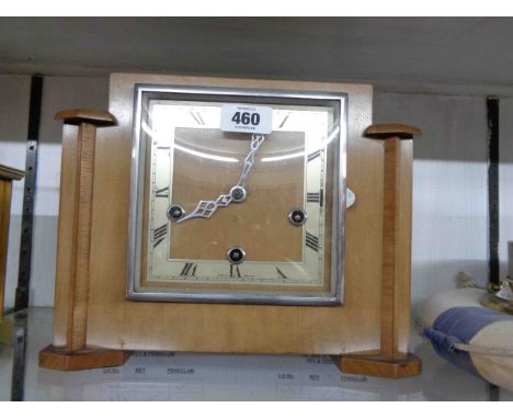 A vintage walnut stepped cased mantel clock with Enfield eight day chiming movement