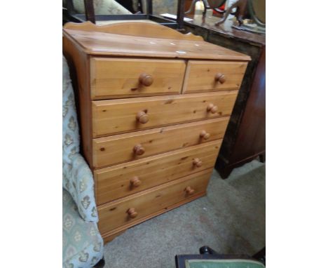 An 82cm modern pine chest of two short and four long graduated drawers, set on bracket feet