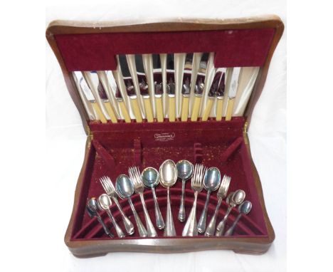 A vintage oak canteen containing a six place setting of silver plated cutlery, the knives with ivorine handles