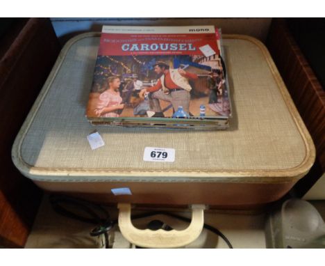 A small vintage cased portable record player - sold with a quantity of 45rpm records