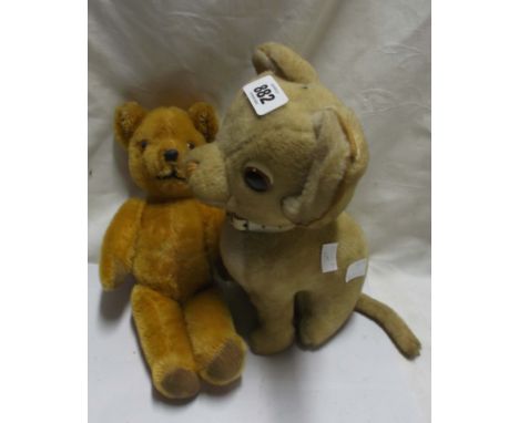 A vintage Merry Thought soft toy with original label - sold with a small vintage teddy bear with articulated joints, glass ey