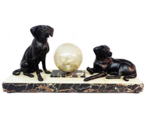 A French marble based Art Deco style lamp with decorative dogs flanking a central crackle glass globe shade