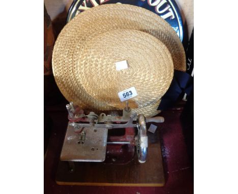 A vintage Ridgmont straw boater hat - sold with a miniature sewing machine