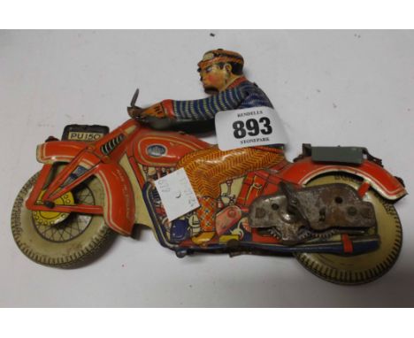 A vintage tin plate clockwork motorbike toy
