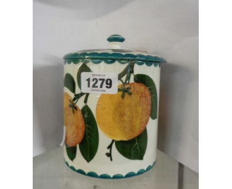 A Wemyss pottery biscuit barrel and lid, depicting oranges and foliage
