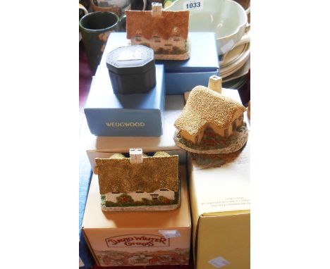A quantity of boxed ornaments comprising a Wedgwood black Jasper vase, a similar trinket box, a Royal Doulton cake knife, dec