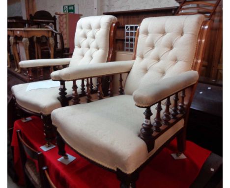 Two similar Victorian walnut framed drawing room armchairs, both with matching button back machine tapestry upholstery and sp