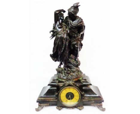 A Victorian ornate bronze figural mantel clock, the top surmounted by a 51cm bronze figure group after L. Gregoire, depicting