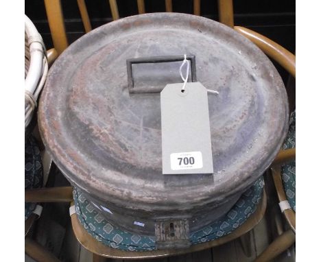A vintage tin hat box with original wood grained finish