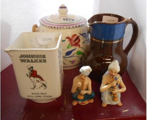 A Poole Pottery biscuit barrel with typical hand painted decoration, a Johnnie Walker advertising pub jug, two German porcela