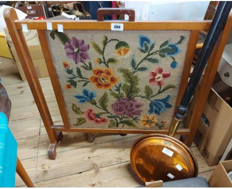 A vintage oak framed fire screen with central floral woolwork panel - sold with a 19th Century copper warming pan