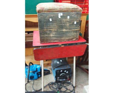 A 1950's red Formica topped drop-leaf table - sold with a wooden kitchen chair and a tapestry lidded box