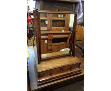 A 19th Century mahogany platform dressing table mirror with oblong plate and three drawers to base, set on bracket feet