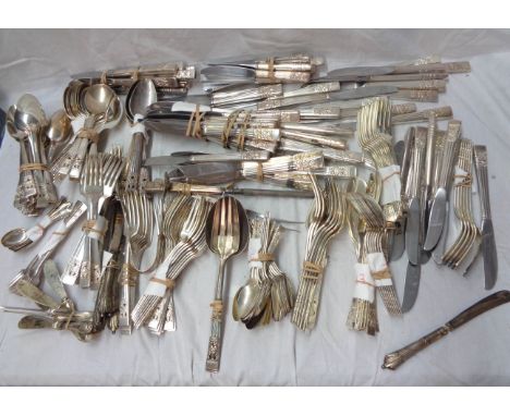 A box containing a large quantity of vintage Community silver plated cutlery with floral decorated terminals