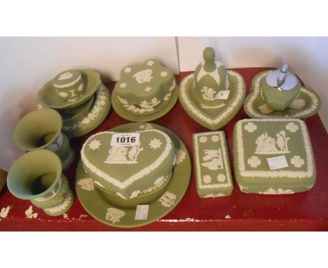A quantity of vintage Wedgwood green Jasper items including trinket boxes, dishes, lighter, bell, etc.