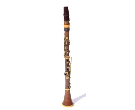 A 19TH CENTURY BOXWOOD AND IVORY-MOUNTED CLARINET Stamped 'Bilton London, 93 Westminster Bridge Road', 59 cm long.