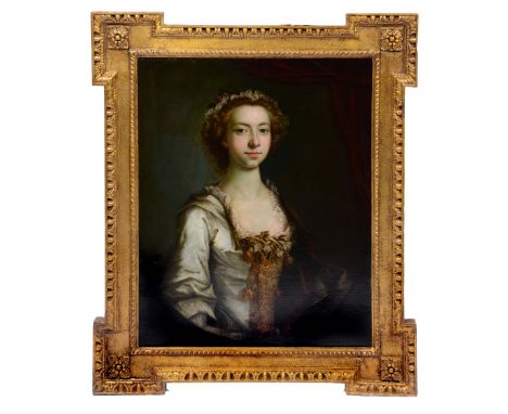CIRCLE OF THOMAS HUDSON (1701 - 1779) Portrait of a lady with brown curly hair wearing a lace trimmed headdress, her white dr