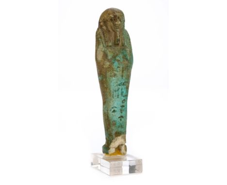 *Ancient Egypt. 30th Dynasty, green faience Shabti of Wah-ib-Re,  the mummiform figure modelled wearing tripartite wig, long 