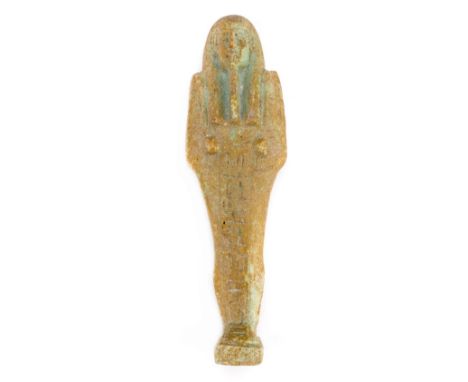 *Ancient Egypt. 26th Dynasty, pale green faience Shabti of Dis-Ast (the gift of Isis),  modelled wearing tripartite wig, long
