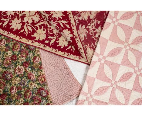*Quilt. A Welsh quilt, circa 1930s,  reversible quilt of printed cotton with pattern of flowers, including roses and peonies,