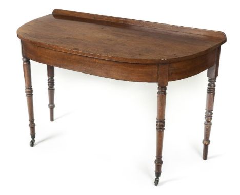 *Side Table. Victorian mahogany demi lune side table,  with turned supports on brass casters, 77cm high x 118cm wide x 60cm d