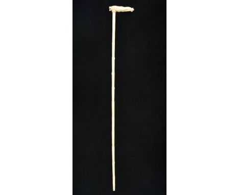 *Walking Stick. A 19th century Anglo-Indian ivory walking stick,  the handles carved as a lion and elephant with bamboo effec