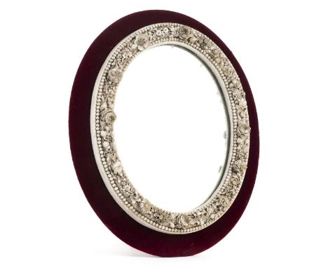 *Mirror. A Victorian floral encrusted porcelain mirror, probably Derby,  of oval form finely decorated with flowers and beade