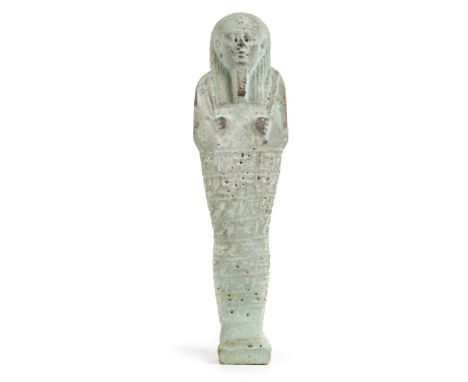 *Ancient Egypt. 26th Dynasty,  blue faience Shabti of Hathor-em-hetep, large finely modelled mummiform figure, wearing striat