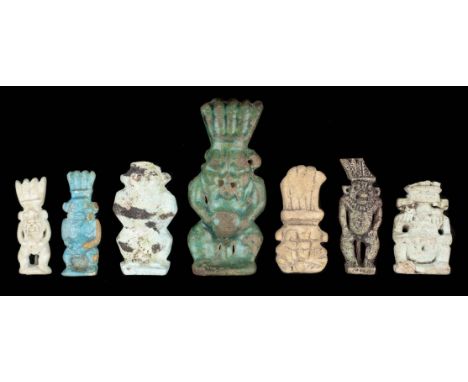 *Ancient Egypt. Collection of 7 Bes amulets,  including a large Roman Period blue / green faience amulet of a standing figure