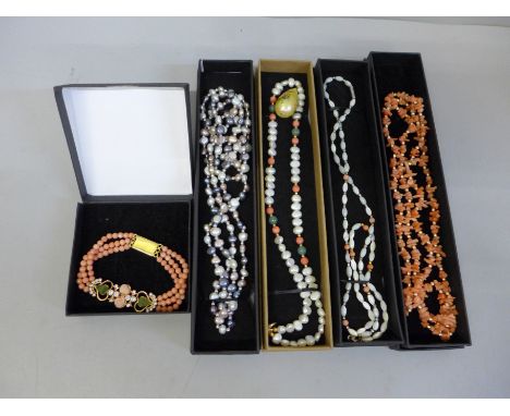 Coral and pearl jewellery; four necklaces and a bracelet 