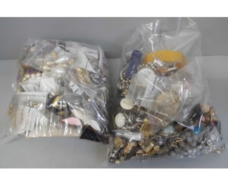 Two bags of costume jewellery, mainly earrings, two watches, bangle, etc. 