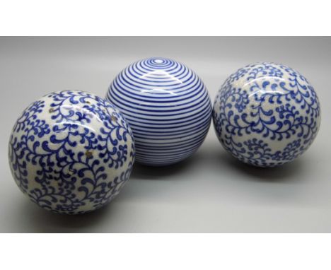 Three blue and white carpet bowls 