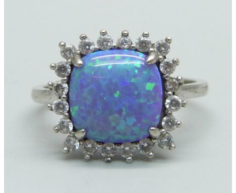 A silver ring set with CZ and a synthetic opal, R 